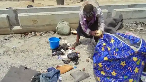 Graphic pics: Female ritualist caught with corpse of a 3yr old boy in Mile 2